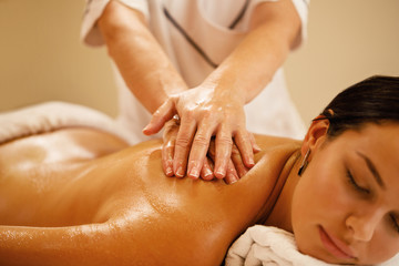Fototapeta na wymiar Close-up of woman getting back massage at the spa.