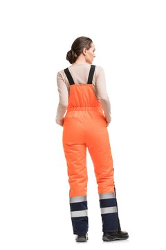 Woman In Orange Working Overalls Rearview