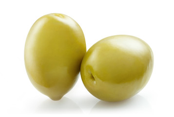 Close-up of two delicious green olives, isolated on white background