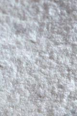Grainy texture of white stone. Raw marble, the basis for future sculpture.