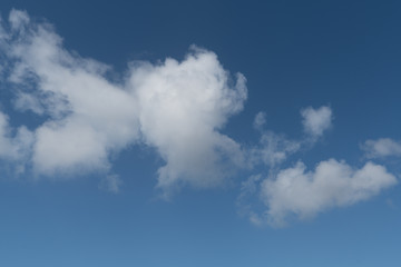 Clouds against clear blue sky