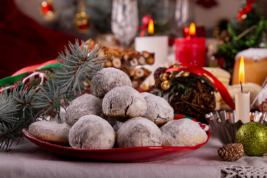 Traditional Christmas almond chocolate snowballs cookies biscuits covered icing sugar powder. Russian Tea Cakes, Mexican Wedding Cookies, Butterballs. Christmas New Year festive ornament decorations.