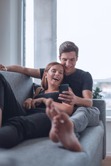 loving young couple relaxing on the couch in the cozy living room