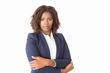Serious confident female business leader looking at camera. Young African American business woman...