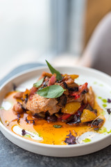 Grilled Tuna Steak with Stewed Vegetables on White Plate.