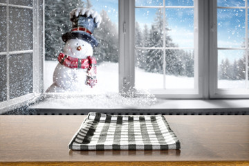 Winter window background of free space and wooden table 