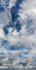 Fantastic clouds against blue sky, panorama