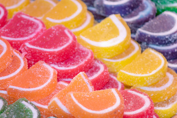 Sweet jelly beans close-up. There are sugar crystals on it.