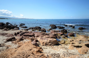 Fototapeta na wymiar coast of the Mediterranean sea in Sardinia Island with Alghero town in the background 