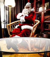 Fototapeta na wymiar Santa claus in home and wooden desk of free space 