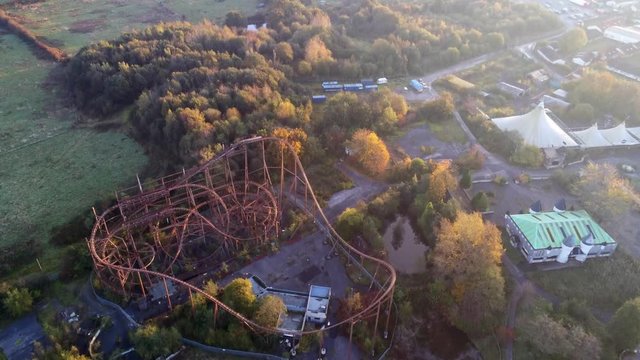 Aerial view above Camelot abandoned theme park roller coaster tracks.