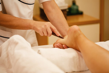 Obraz na płótnie Canvas Close-up of foot massage at the spa.