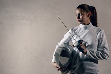 Fencer woman with fencing sword.