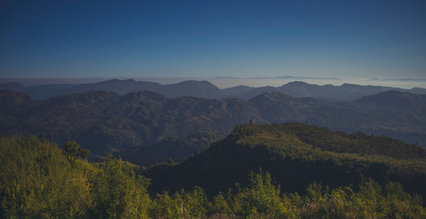 GREEN NATURE WITH BEAUTIFUL MOUNTAIN AND BLUE SKY