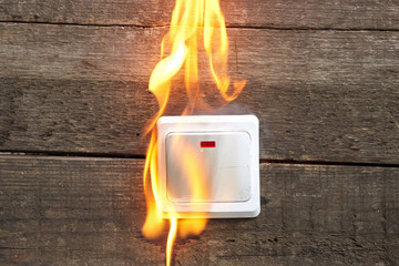 tongues of flame from wall socket, smoke fire occurred. Danger to life and health