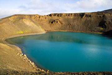Fototapeta na wymiar View of Krafla volcano crater with water, tourist popular attraction in Lake Myvatn, Iceland
