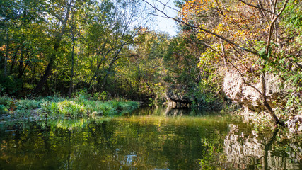 Missouri lake in autumn with rocks and trees