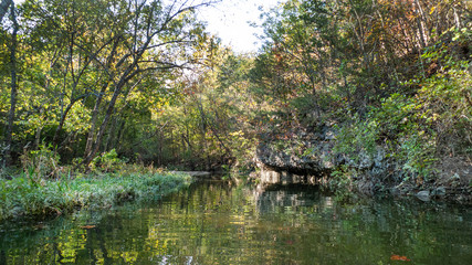 Missouri lake with rocks and trees, autumn reflections