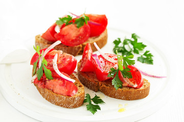 Bruschetta with tomatoes and onions. Selective focus