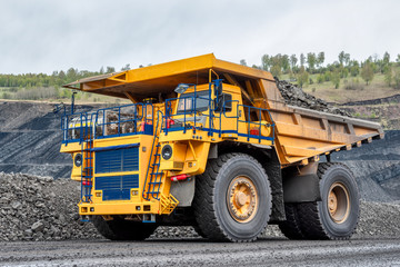 Obraz na płótnie Canvas Quarry truck carries coal mined.