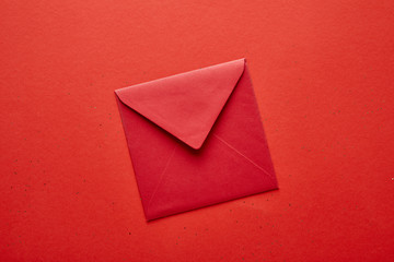 top view of red envelope on red background