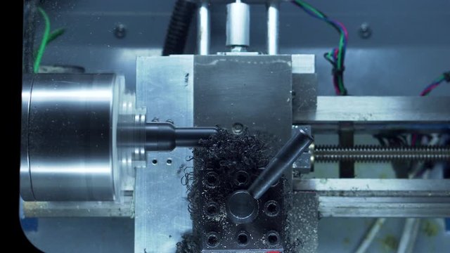 Desktop CNC lathe cutting chess pawn out of plastic stock real time part 3 medium shot