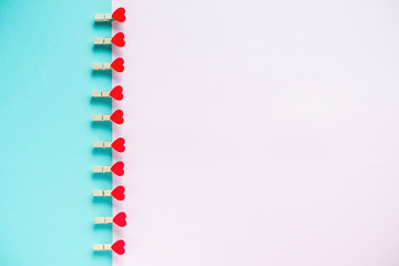 Hearts on pastel blue and pink background. Valentines day concept. Flat lay, top view, copy space. Valentine's Day background.