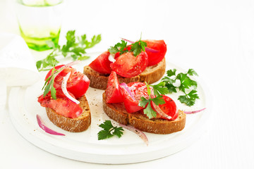Bruschetta with tomatoes and onions. Selective focus