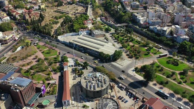 Aerial drone video of famous urban public area of Gazi and Kerameikos in the heart of Athens, Attica, Greece