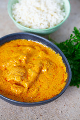 chicken curry and rice on granite surface