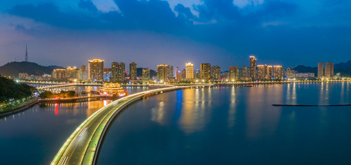 Fototapeta premium Couple Road and Beaver Island Beach Night View in Zhuhai City, Guangdong Province