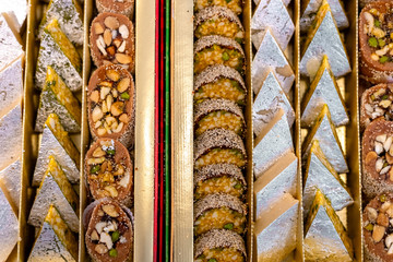A mixture of various Indian sweets packed in a box. Peda, laddu, mithai, diwali sweets