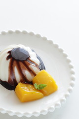 Chinese dessert, almond tofu and mango with chocolate sauce