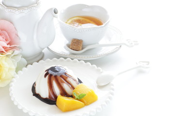 Chinese dessert, almond tofu and mango with chocolate sauce