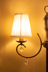 Close up photo of traditional bra lamp with warm yelow light