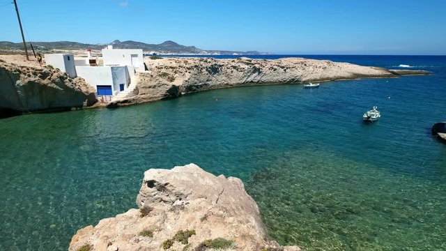 Typical small fishermen' village on Milos island, Greece - panning