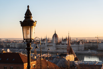 Fototapeta na wymiar Street lamp in focus and Hungarian parliament in the background