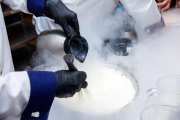 Chef is cooking ice cream with liquid nitrogen