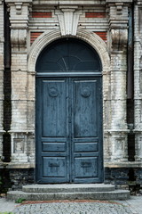 Old vintage door in an old brick building