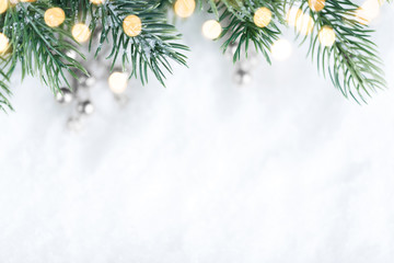 Closeup of Christmas tree with light, snow flake. Christmas and New Year holiday background.