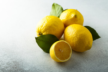 Fresh lemons with green leaves