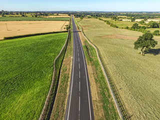 Fototapeta na wymiar Aerial View of a road through fields