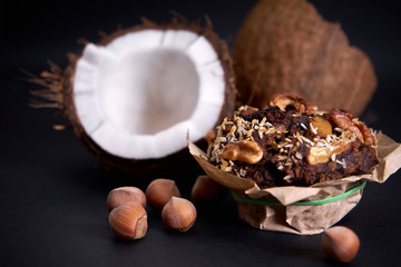 delicious diet muffins and coconut lie on paper on the table.