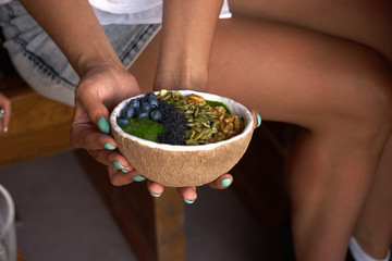 women sit at the workshop and take pictures of smoothie bowl