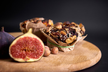 delicious fresh muffins and figs and hazel lie on the board