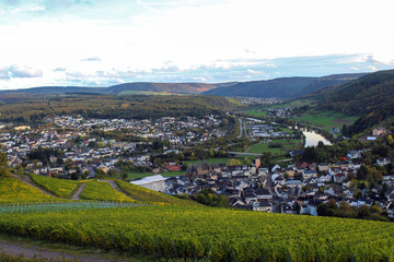 View on the Saar river and Saarburg town from vineyards hills near Saarburg, West Germany. October, autumn. 