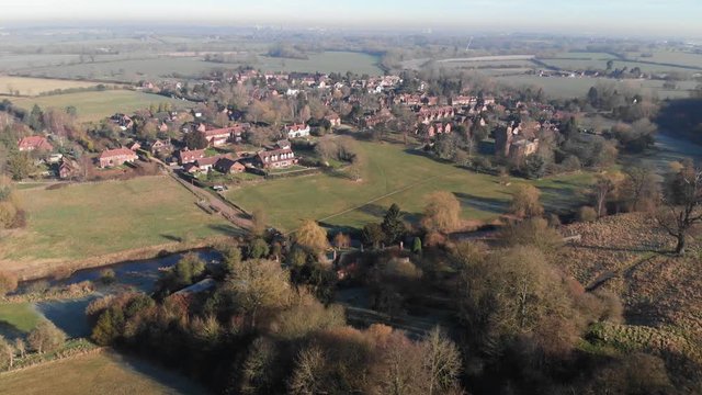 Aerial View Of English Village Warwickshire, City In Distance Smog 4K