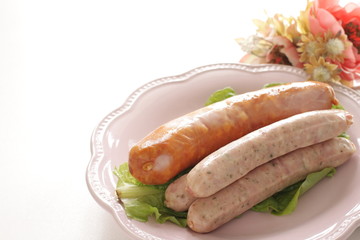 Prepared Germen sausage on dish with copy space
