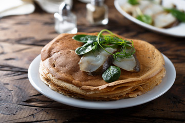 Homemade crepes with smoked fish