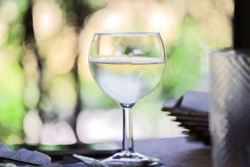 Glass with wine on the table